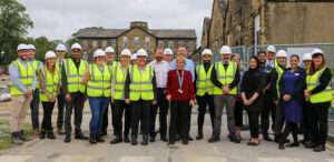 A group of Darwin Group employees and NHS staff at the ground breaking ceremony for the new day case unit at St Luke's in Bradford.