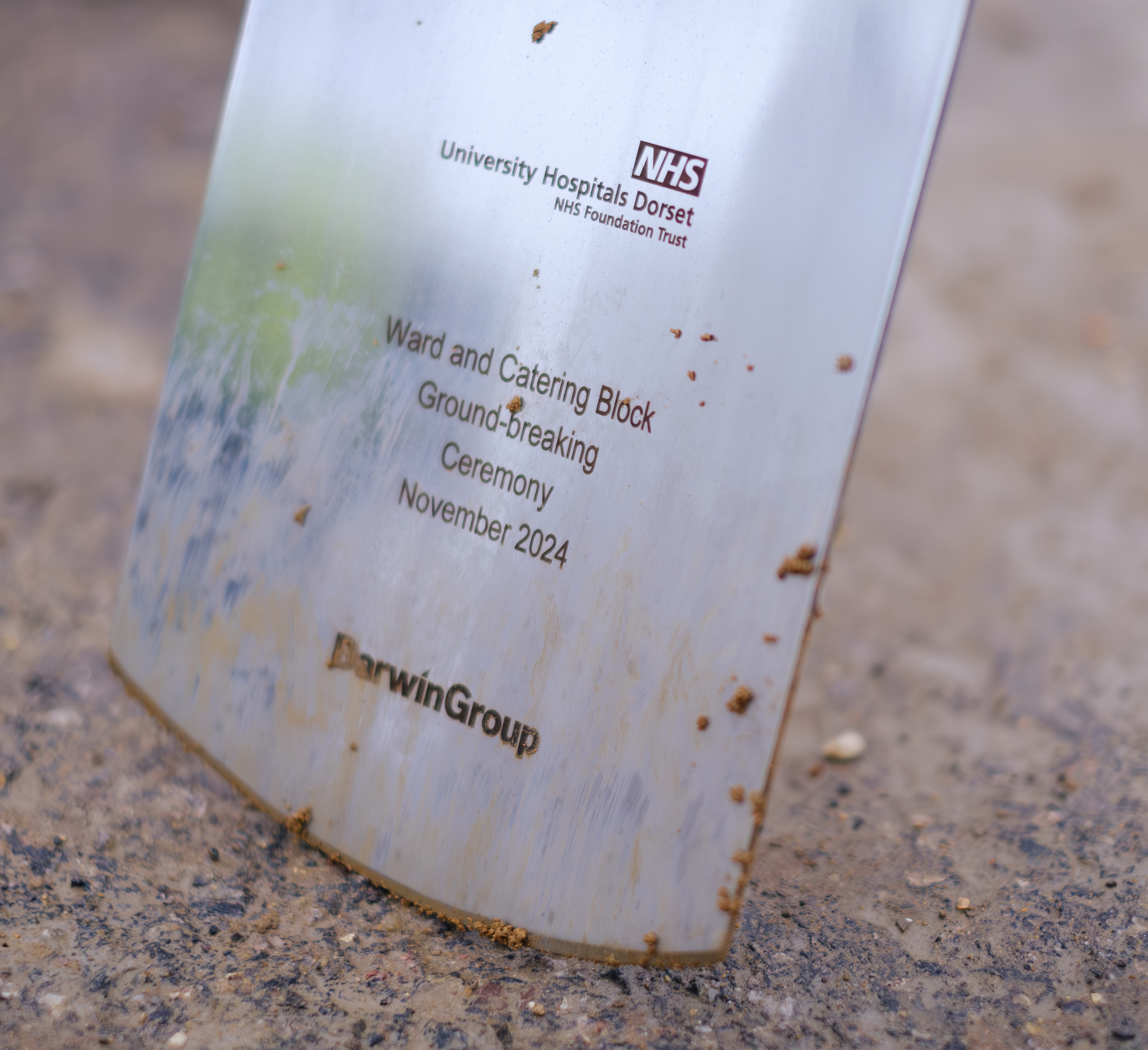 Engraved ceremonial spade that marks the ground breaking event